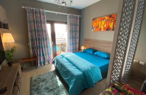 Village Road Apartment | Stylish Pool view studio in Al Dau Heights