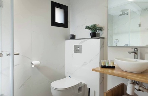 Tiberias Apartment | This cozy apartment offers ample space, featuring a comfortable living room perfect for relaxation