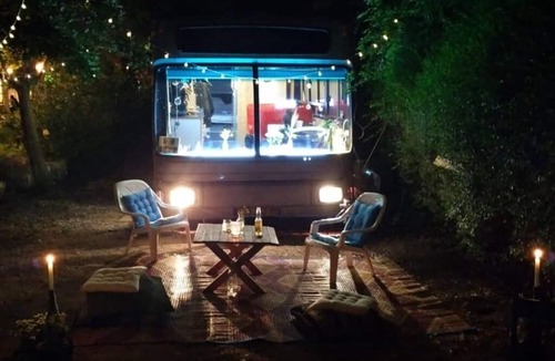 Savyon House | This public bus was converted into a cool and comfortable living space. Located.