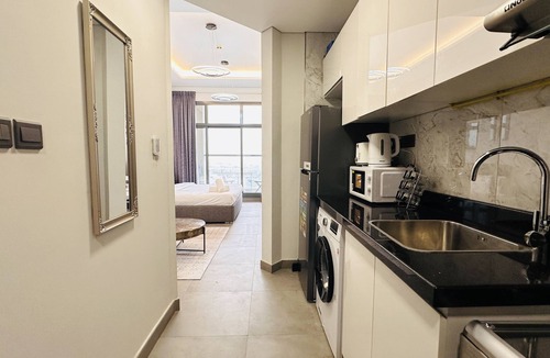 Business Bay Apartment | Upscale Apartment at Oval Tower Near Downtown with Balcony and Parking by Belvilla