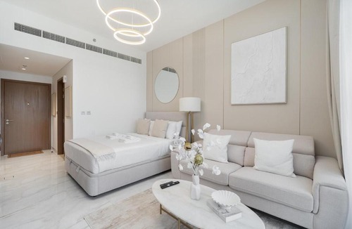 Dubai Apartment | Vibrant Room in Studio City - Azizi Beach Mirage