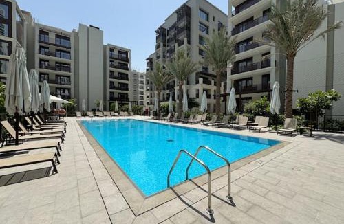 Madinat Zayed Apartment | Vogue Vacation Homes, Creek Beach Rosewater Waterfront Living close to Downtown, Burj Khalifa and Dubai mall, Two Bedroom Apartment with Balcony and Vibrant Community View, Private Manmade Beach, Access to all Amenities