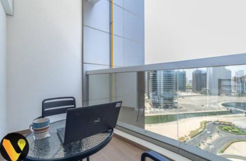 Dubai Sports City Apartment | Vogue Vacation Homes, Sports City Hera Tower Near First Avenue Mall, Studio Apartment with Balcony, Canal and City View, Access to all Amenities