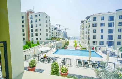 Dubai Apartment | Yogi - 1BR sea view apt with balcony & pool access