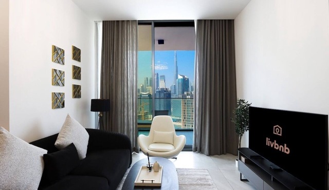 1BR Paragon Tower | Burj Khalifa & Canal Views