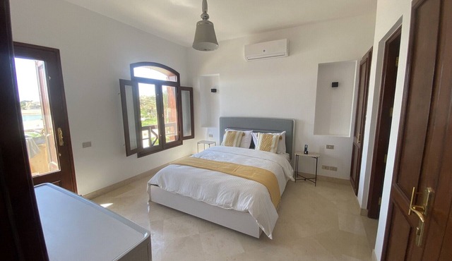 2 BR flat overlooking open lagoon and private pool