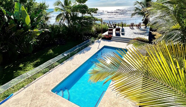 A true beachfront home on a surf break
