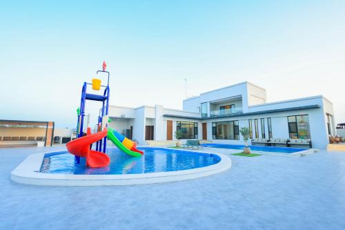 Al Tharaa Chalet استراحة الثراء