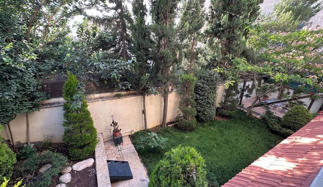 Centrally Located Bright 2 BR Apartment with Breathtaking Tropical Tree Garden!