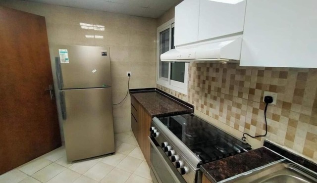 Charming 2-bedroom apartment with WiFi, AC in serene Ajman