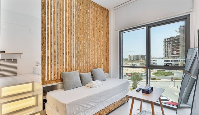 Chic Studio with Pool and Gym Access I 18-Mins to Dubai Expo City