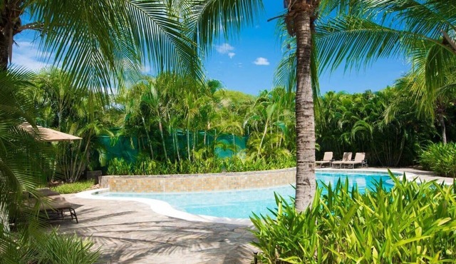 Colorful Poolside Condo w/Garden-View Patio & Resort-Style Amenities