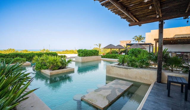 Contemporary beachfront apartment with pool, gym, ocean views, and balcony space in Telchac-Puerto