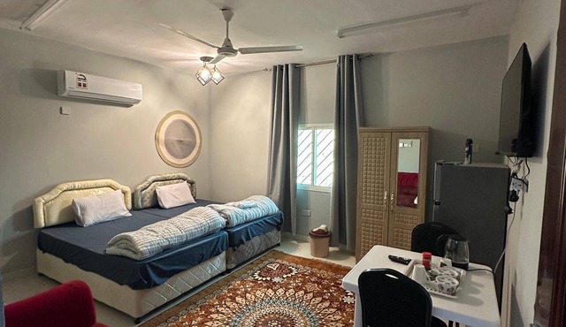 Cozy 1-bedroom bed & breakfast in perfect Wilayat Al Hamra with AC