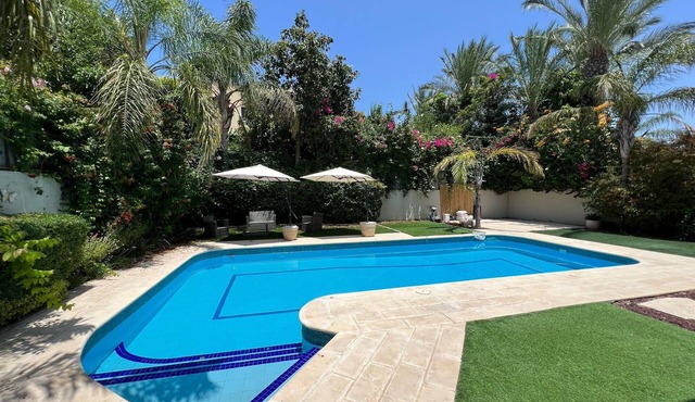 Elegant 5BR Haven with Sparkling Pool & Serene Garden Oasis