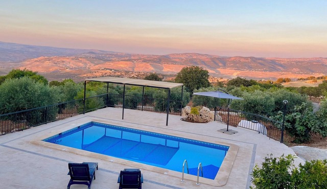 Escape to Zai Zaman Villa—stunning views, rustic charm, and a breathtaking pool.