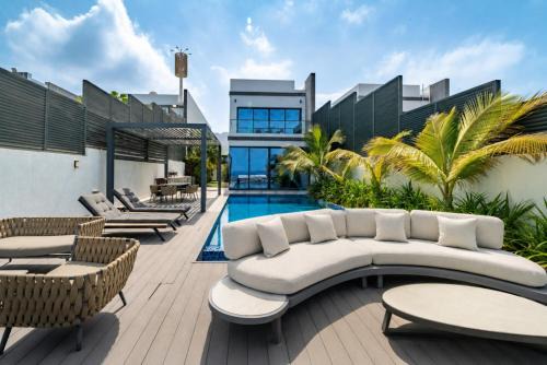 Exclusive 4BR Villa with Assistant Room, Lush Garden & Private Pool Facing Panoramic Sea Views, Al Dana Island, Fujairah by Deluxe Holiday Homes