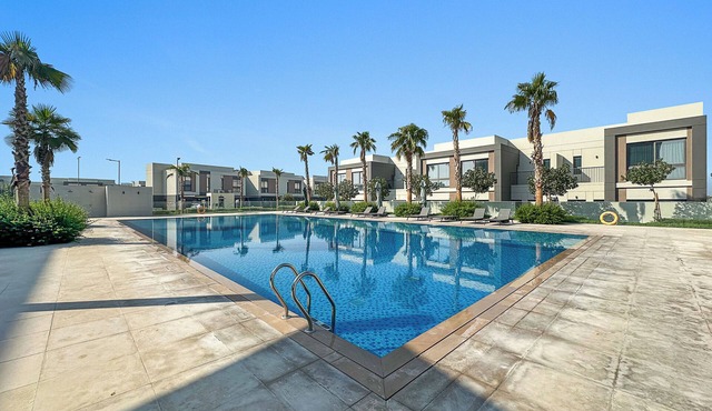 Family 4BR Villa with a Shared Pool, Gym & Private Garden