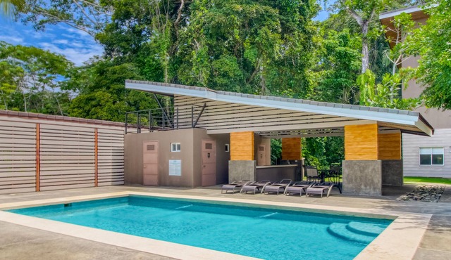 Ground-level apartment with gated entrance and shared pool