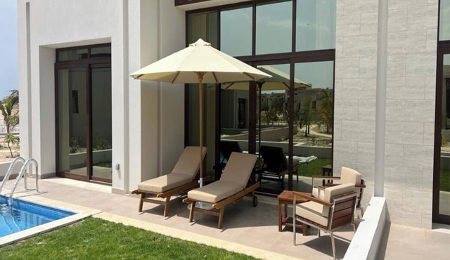 One-Bedroom Oasis with Pool View