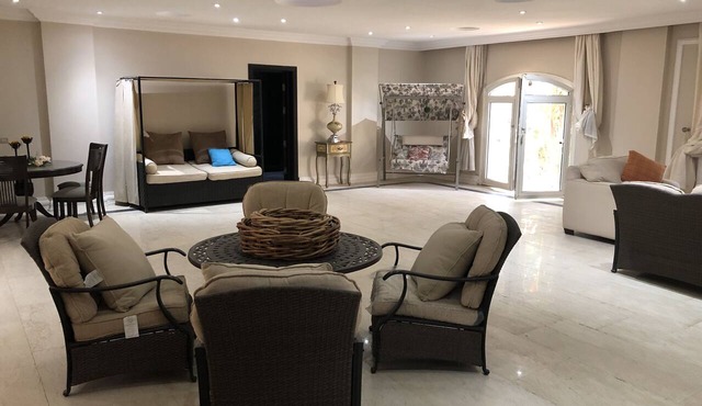 Private resort type condo setting with full access to garden and pool in Al-'Amriyah