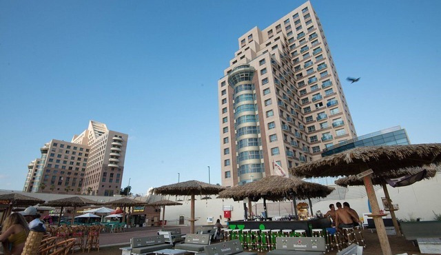 sea sun and fun on the mediterranean beach , restaurants and bars near by