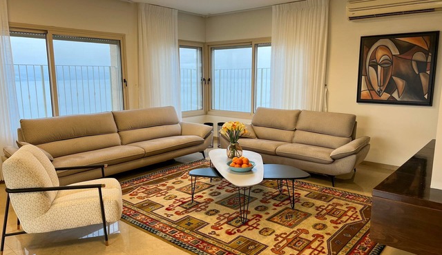 sea view penthouse with 3 floors and an hot tub! can host up to 15 people .