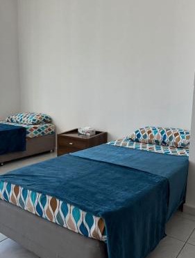 Single bed in al Majaz 2 - سوبر ديلوكس سرير مفرد في شقة فندقية