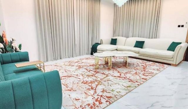 Spacious 4-bedroom villa in serene Ajman with AC comfort