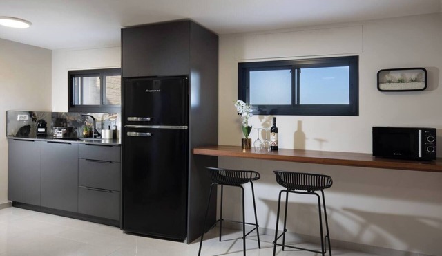 This cozy apartment offers ample space, featuring a comfortable living room perfect for relaxation
