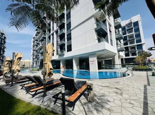 Vogue Vacation Homes, Dubai International City Olivz by Danube near Dragon Mart, One Bedroom Apartment with Balcony and City View, Access to all Amenities