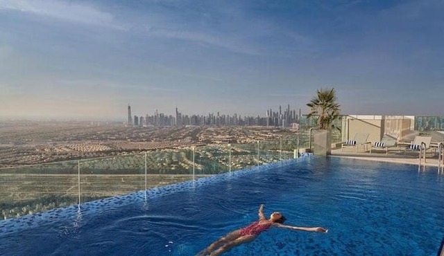 Vogue Vacation Homes, Novotel Residences JVT near Springs Souk Mall, One Bedroom Apartment with Large Balcony and Vibrant Community view, Access to all Amenities