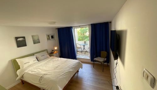 One-Bedroom Apartment with Balcony and City View