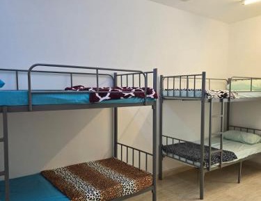 Single Bed in Dormitory Room