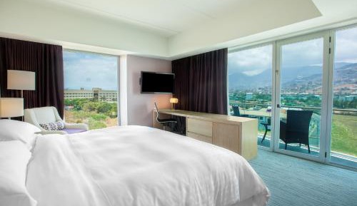 Larger Deluxe King Room with One King Bed and Balcony - Mountain View/Club Access/Rain Shower