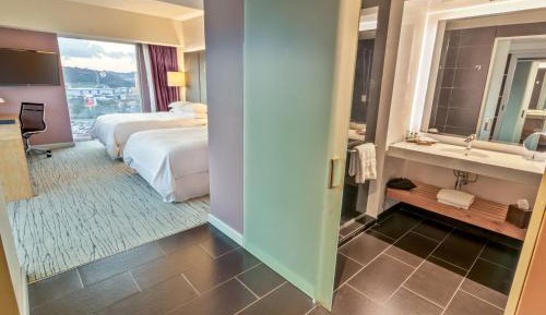 Larger Deluxe Queen Room with Two Queen Beds and Balcony - Mountain View/Club Access/Rain Shower
