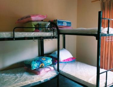 Single Bed in Dormitory Room