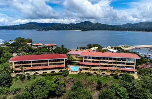 Playa Flamingo House | Remodeled Top-Floor Condo with Stunning Wrap-Around Balcony Offering Mountain, Ocean & Marina Views